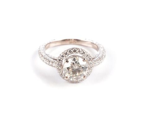 A DIAMOND RING Claw-set to the centre with a round brilliant-cut diamond weighing approximately 1,30ct, approximate colour Q 