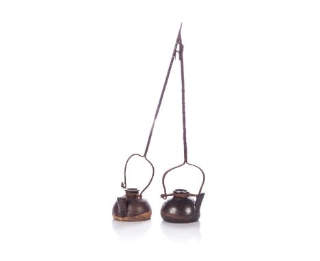 A NEAR PAIR OF CHINESE BROWN GLAZED STONEWARE OIL LAMPS, QING DYNASTY, 18TH CENTURY Each modelled as a small tea-pot shaped l