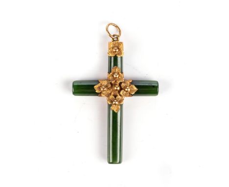 A GREEN STONE PENDANT, POSSIBLY SPINACH JADE In the form of a cross, embellished with foliate motifs, acid tested as 18ct gol
