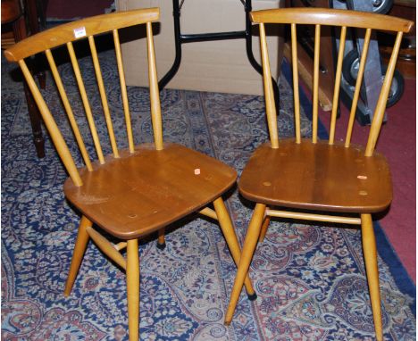 A pair of 1960s Ercol light elm stickback kitchen chairs