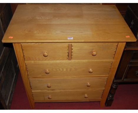 A contemporary light oak chest of two short over three long drawers, width 82.5cm