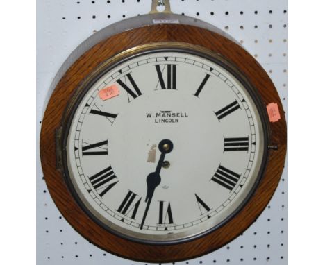 A 1930s Elliott circular wall clock, the white enamel 10" dial signed W. Mansell Lincoln