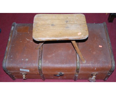 An early 20th century canvas, wood and metal bound cabin trunk, together with an elm milking stool, and a wall mirror (3)