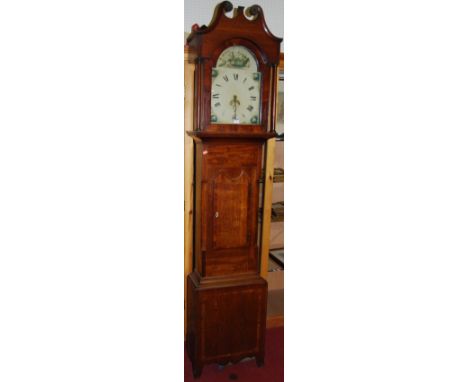 A circa 1800 provincial oak and mahogany crossbanded longcase clock, having an arched painted dial, subsidiary seconds hand, 