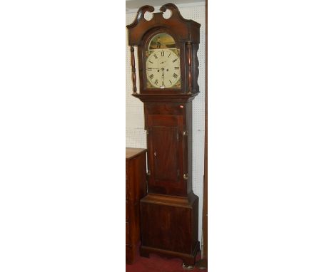 A circa 1800 North Country mahogany and ebony strung longcase clock, having a painted arched dial with twin winding holes and