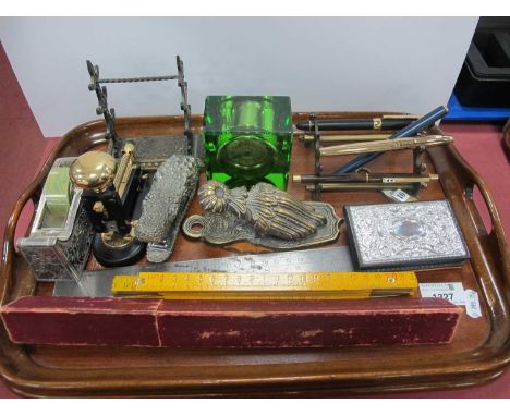 Desk Equipment, including writing pens, crocodile stapler, pen racks, slide rule, paper clip, tit-bits clock and tray.