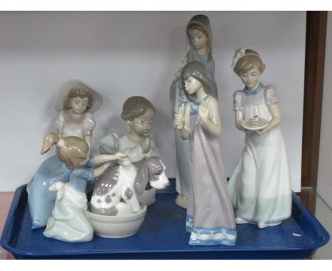 Lladro figurines Bashful Bather Girl, Happy Birthday, Quiet Evening two others and one Nao. (6)