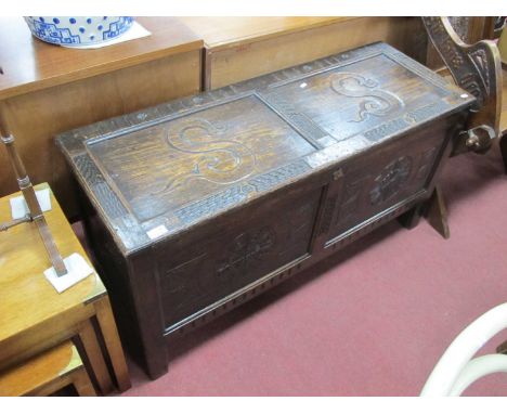 XVII Century Style Carved Oak Coffer, with a carved two panel top with a letter S, carved, on stile feet, 118cm wide.