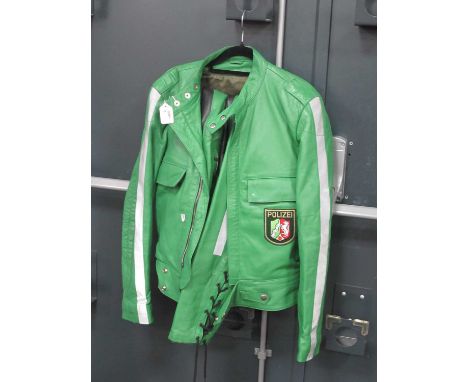 Green Leather Two Piece Motorcyclists Outfit, with Polizei badge to jacket.No label, trousers approximately waist 40cm, jacke