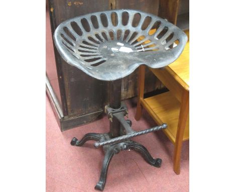 Cast Iron High Chair, with tractor seat and foot bar.