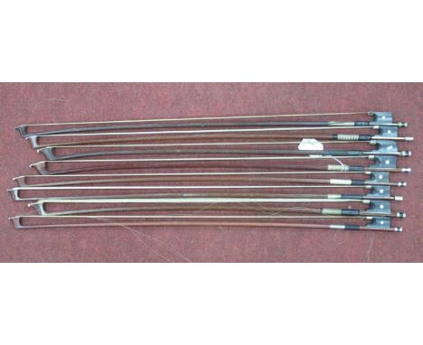 Eight Various Violin, Viola and Cello Bows, some with mother of pearl inserts to end, longest approximately 75cm long. (8).