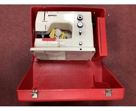 Bernina Sewing Machine 18111532, in red case. Untested sold only for parts.Includes box of accessories but no instruction man