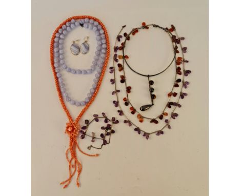 A collection of gemstone bead necklaces, to include amethyst, banded agate, tigers eye, coral etc. along with a pair of lace 