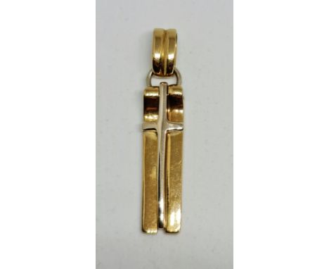 A hallmarked 18ct yellow gold articulated cross pendant comprising of three sections, jump ring engraved 'Regina', measures a