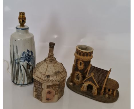 A Colin Kellam studio pottery lamp base, 30cm, and two studio pottery buildings with marks to base. IMPORTANT: Online viewing