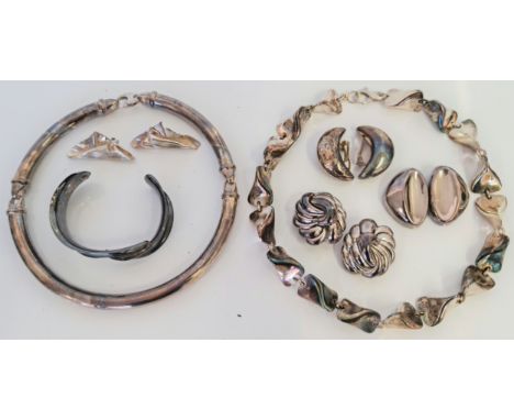 A collection of various jewellery some of Continental design, to include two necklaces, a bangle and four pairs of earrings, 