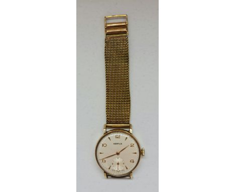 A gents Vertex wrist watch, the cream dial having hourly alternating Arabic numbers and arrow markers, with subsidiary dial t