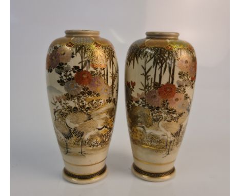 A pair of Japanese fine detail satsuma vases, with red-crowned cranes in rural landscape to body, character marks to base, he