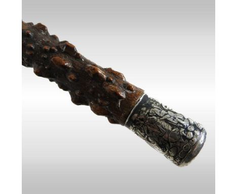 A 19th century gnarled wooden walking stick, with an engraved white metal handle, 87cm long