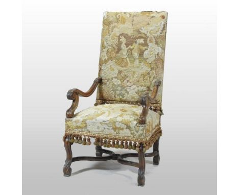 A 19th century French walnut tapestry upholstered open armchair, with acanthus carved arms and scroll carved legs united by a
