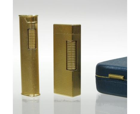A Dunhill vintage gold plated U.S. patent cigarette lighter, circa 1970's, of rectangular shape, with engine turned decoratio