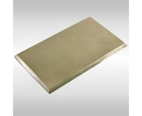 A large 9 carat gold cigarette case, of plain rectangular shape, with a sliding catch and engine turned decoration, 15cm long