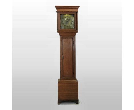 An 18th century oak cased longcase clock, the brass dial with pierced brass spandrels, the chapter ring showing Roman hours a