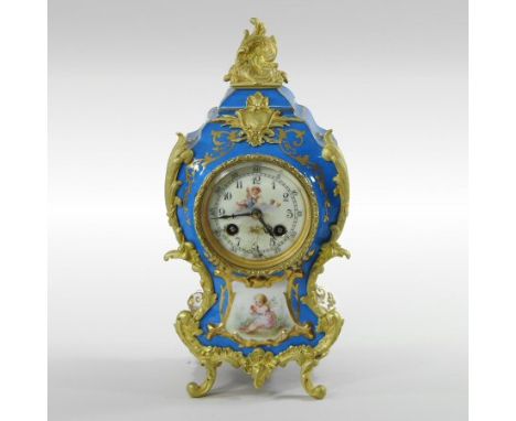 A French Sevres style porcelain and gilt metal mounted mantle clock, the blue celeste case with scrolled mounts, having a pai