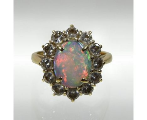 A gold opal and diamond cluster ring