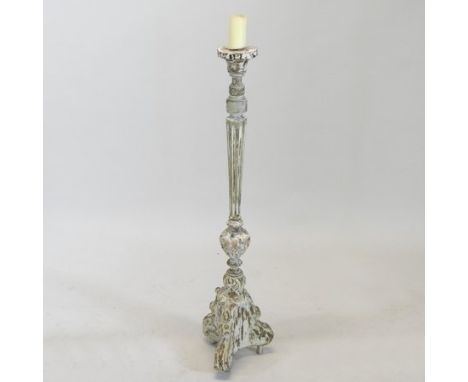 An 18th century continental carved pine and gesso altar stick, 104cm high