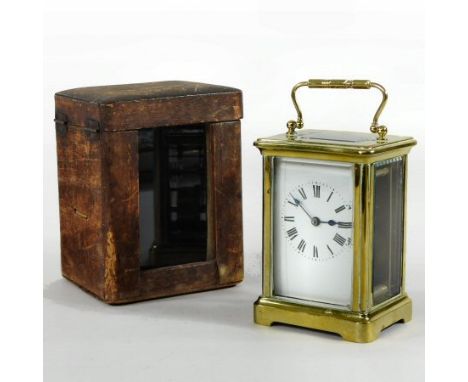 An early 20th century French brass cased carriage clock, the dial with Roman numerals, 12cm high, housed in a fitted wooden c