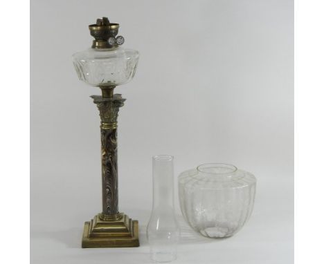 A 19th century brass oil lamp, with a marbled column and glass shade, together with another with a clear glass reservoir, 78c