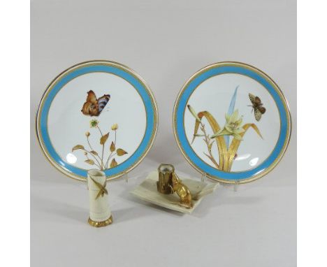 A pair of 19th century Worcester porcelain botanical dessert plates, each painted with a butterfly and flowers, within a gilt