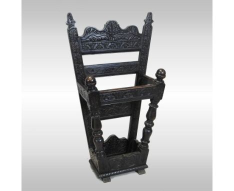 A Victorian heavily carved dark oak stick stand, of tapered shape, 52cm