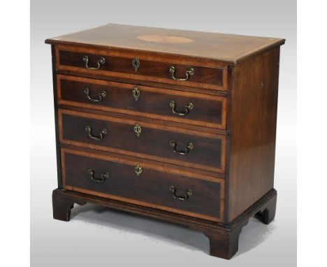 A George III mahogany and satinwood inlaid chest, containing four long graduated drawers, on bracket feet, 86cm