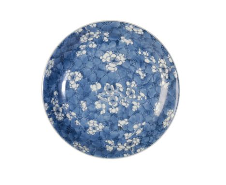 BLUE AND WHITE 'ICE CRACKLE' CHARGER, KANGXI PERIOD, decorated throughout with blossoming prunus branches, 34cm diam