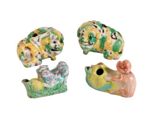 PAIR OF EGG AND SPINACH-GLAZE POTTERY JOSS-STICK HOLDERS, KANGXI PERIOD, modelled as mythical beasts, 6cm high; together with