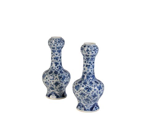 PAIR OF BLUE AND WHITE GARLIC MOUTH VASES, LATE QING DYNASTY, the baluster sides painted in tones of underglaze blue with ver