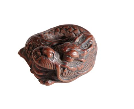 JAPANESE CARVED WOOD NETSUKE, NOGOYA SCHOOL, LATE EDO PERIOD, modelled a s a coiled dragon, 3cm wide