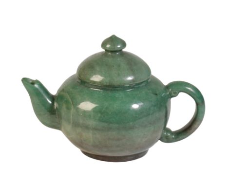GREEN HARDSTONE TEA POT, REPUBLIC PERIOD, of baluster form with scroll handle, and knop-finial, 12cm high