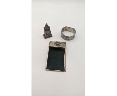 Silver to include a miniature chair, napkin ring and one other itemsLocation:If there is no condition report shown, please re