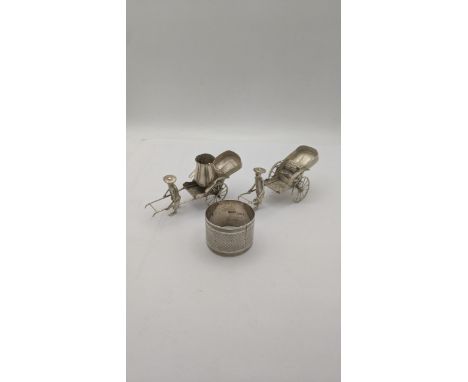 A pair of white metal condiments A/F stamp 90 94.7g together with a silver napkin ring 34.4gLocation:A3MIf there is no condit