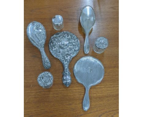 Silver dressing table items to include two hand mirrors, three dressing table jars and two brushesLocationIf there is no cond