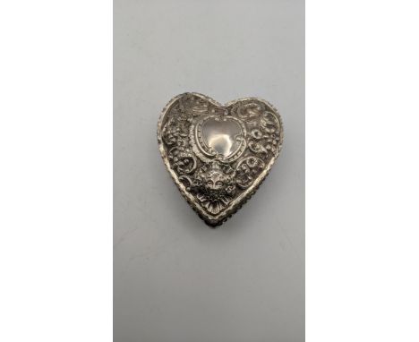 A silver heart shaped trinket box having floral embossed decoration hallmarked London 1887, 109.3gLocationIf there is no cond