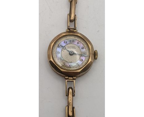 A ladies 9ct gold manual wind wrist watch having a Mother of Pearl dial, on an expanding 9ct gold bracelet A/F total weight 1