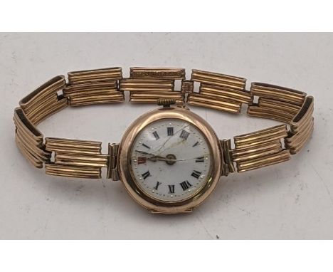 A 9ct gold ladies manual wind wrist watch A/F on a 9ct gold expanding bracelet total weight 19.9gLocation:If there is no cond
