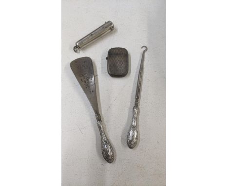Silver items to include an engine turned vesta, a cheroot case, a silver handled shoe horn and a button hookLocation:If there