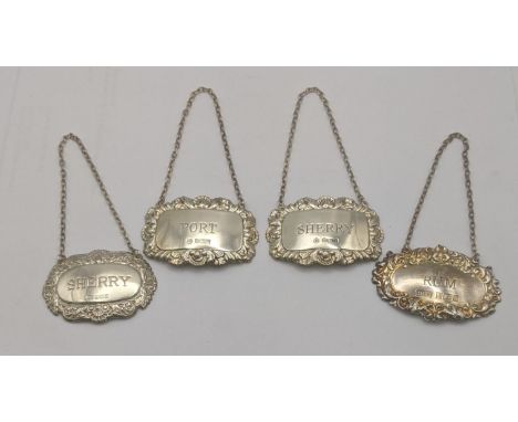 Four silver decanter labels to include a pair of hallmarked Sheffield 1987 inscribed 'Port' and 'Sherry' along with two other