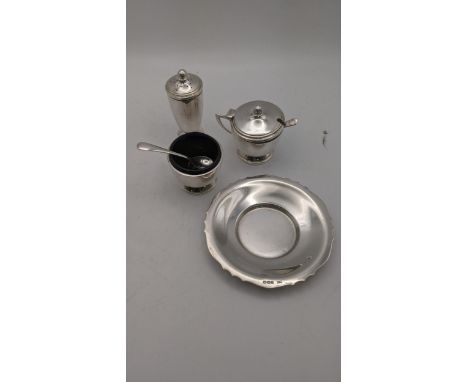 A three piece silver condiment set with blue glass liners hallmarked Birmingham 1961 together with a pin dish, total weight, 