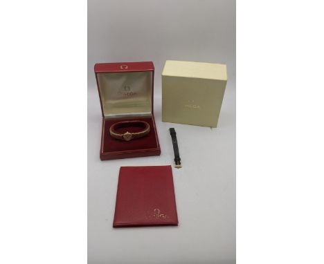 A 9ct gold ladies Omega manual wind wrist watch with its box and paperworkLocation:If there is no condition report shown, ple